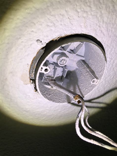 how to remove junction box with hanger bar from ceiling|removing old ceiling fan box.